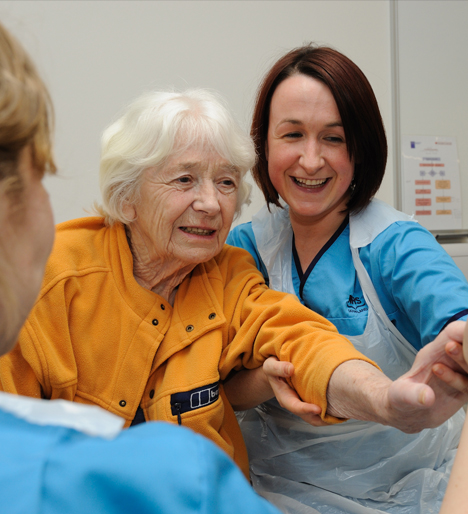 Elderly lady with a nurse